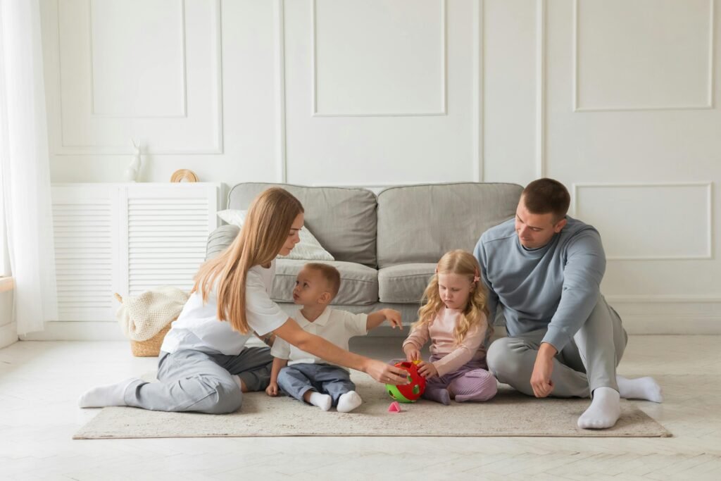 pexels photo 31152789 31152789 Family bonding time on the carpet in a cozy living room setting.